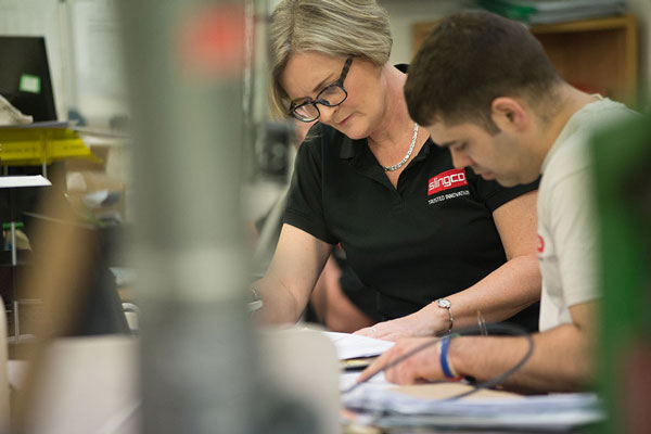 Slingco employees in factory